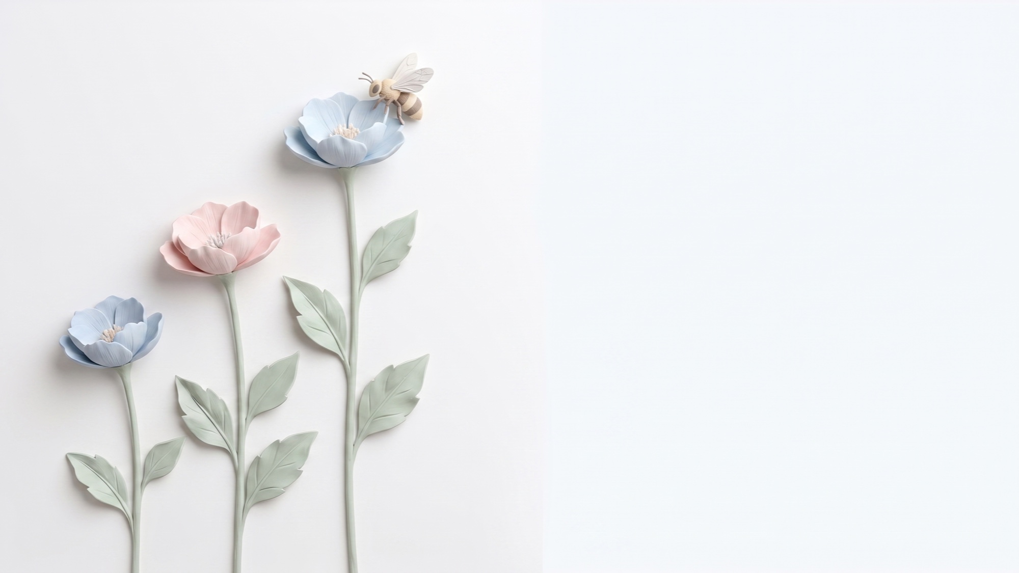 A hand-sculpted plaster relief of ascending stems in soft cream